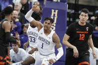 Washington forward Nate Roberts (1) reacts to a play, next to Oregon State center Roman Silva (12) during the first half of an NCAA college basketball game Thursday, Jan. 16, 2020, in Seattle. (AP Photo/Ted S. Warren)