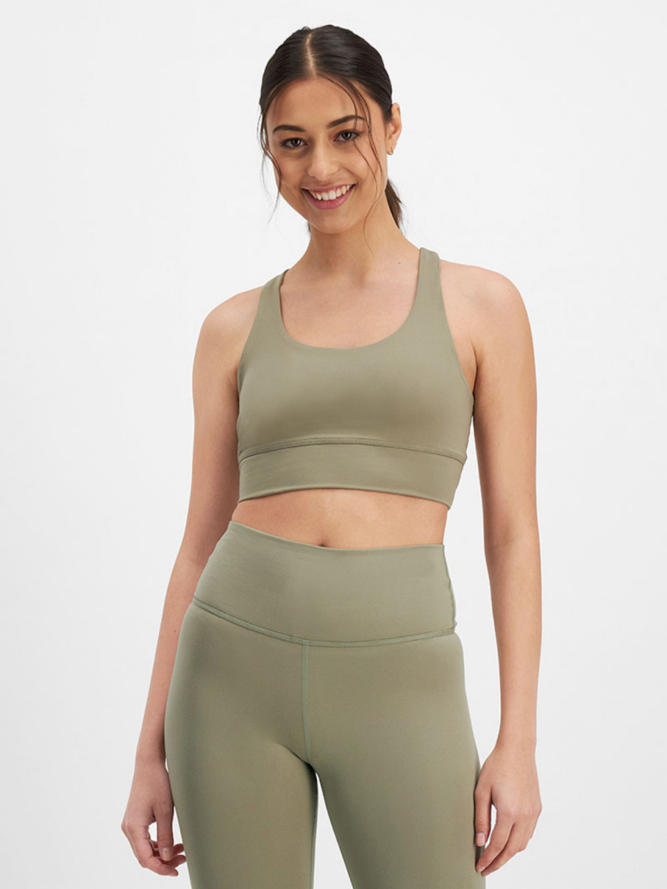 Model wearing khaki sports crop from Bonds