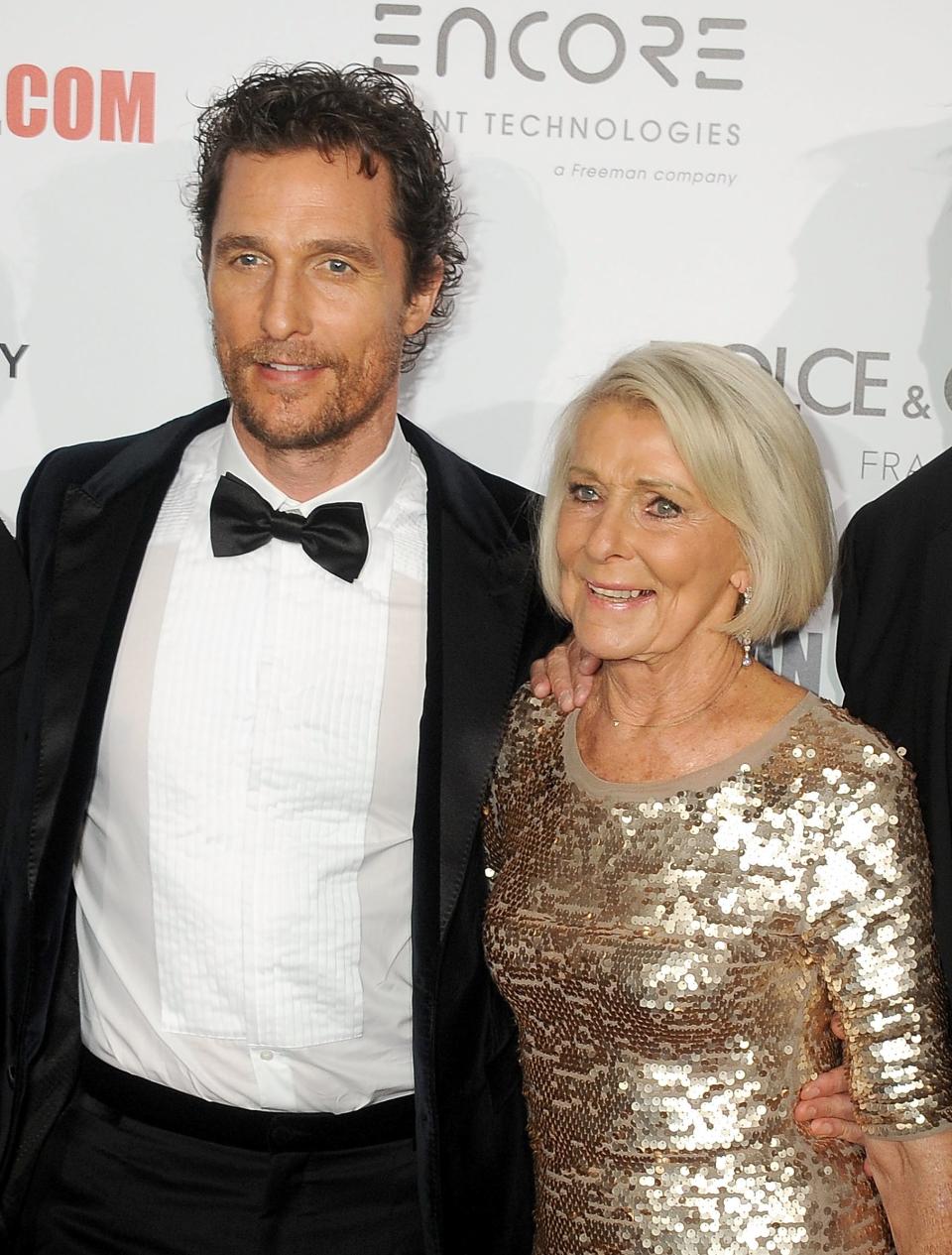 Matthew McConaughey and his mom posing together at an event