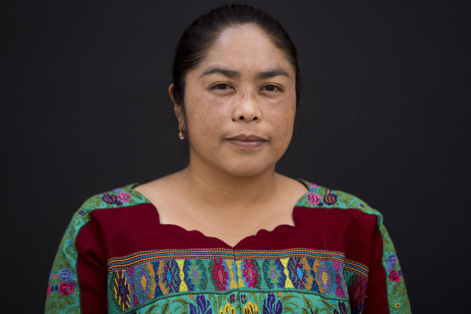 Ingrid Jhanet Simón Perén poses for a portrait in San Juan Comalapa, Guatemala, Tuesday, June 20, 2023. The first grade teacher is mostly concerned by ever-rising prices for basic foodstuffs, Guatemala’s deep inequality and a lack of jobs that could dim the future prospects of her rural students, ahead of June 25 elections (AP Photo/Moises Castillo)