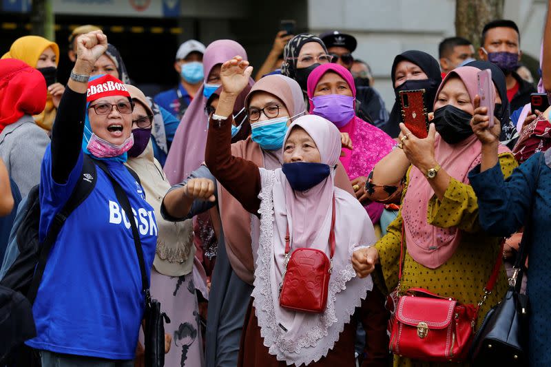 Supporters of former Malaysian Prime Minister Najib Razak shout slogans outside the Federal Court, in Putrajaya