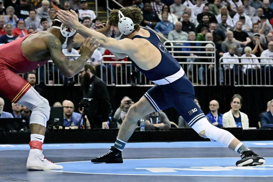 Penn State’s Mitchell Mesenbrink, right, wrestles against Iowa State’s David Carr during the 165-pound NCAA championship match Saturday night at the T-Mobile Center in Kansas City, Mo. Carr won 9-8 to give Mesenbrink his first and only loss of the season.