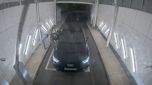 CCTV still of an Audi leaving an airport car park