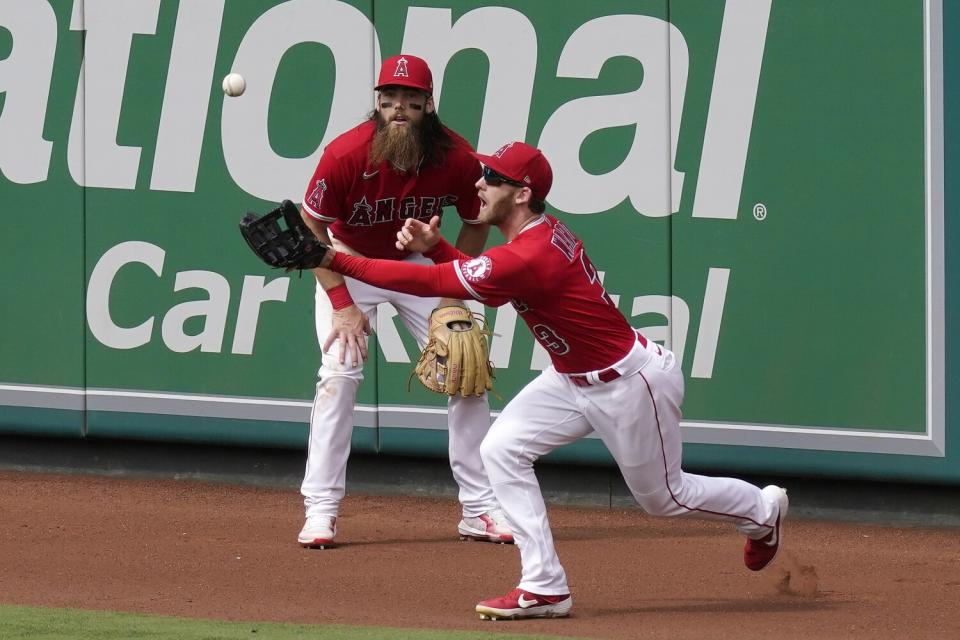 Angels right fielder Taylor Ward fields a ball hit for a three-run double by the Rangers' Ezequiel Durán.