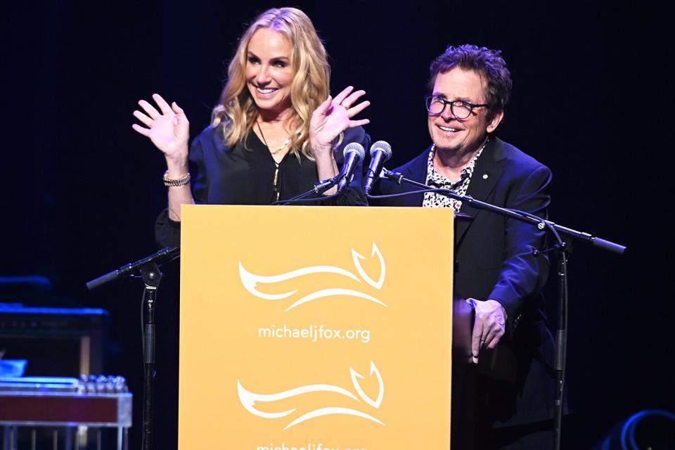 Tracy Pollan (L) and Michael J. Fox speak onstage during the 2021 A Funny Thing Happened On The Way To Cure Parkinson's gala on October 23, 2021 in New York City.