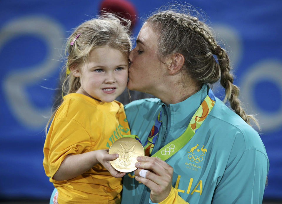 <p>Nicole Beck of Australia celebrates winning her gold medal with her daughter Sophie Willoughby after the medal ceremony for women’s rugby on August 8, 2016. (REUTERS/Phil Noble) </p>