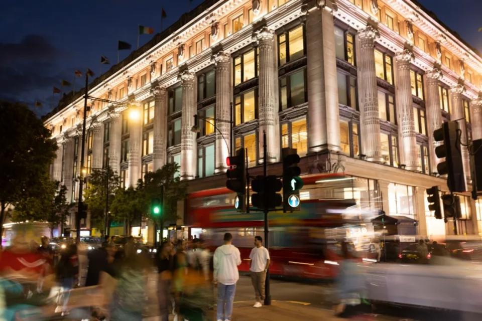 LONDON, ENGLAND - AUGUST 15: Selfridges department store is lit up at dusk on Oxford Street on August 15, 2023 in London, England. The 1.2 mile stretch, one of London’s premier shopping destinations, is suffering. Currently 16% of retail properties stand empty, crime levels are rising, there is a surge in rough sleepers and a 59% decline in footfall from before the pandemic. (Photo by Dan Kitwood/Getty Images)