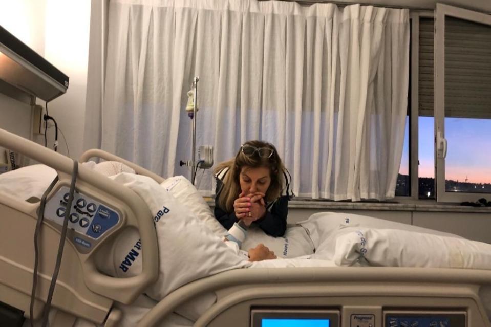 Caroline Breure's mum Juceli at her daughter's bedside in the Barcelona hospital. Source: GoFundMe 