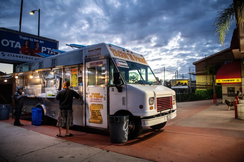 BOYLE HEIGHTS, CA- March 23, 2020: The nightly crowds have thinned at Tacos El Pecas on Monday, March 23, 2020. Taco trucks are just one of the many facets in the service industry that is being hit hard economically as COVID-19, aka Coronavirus, continues to spreads throughout the country and the world. (Mariah Tauger / Los Angeles Times)