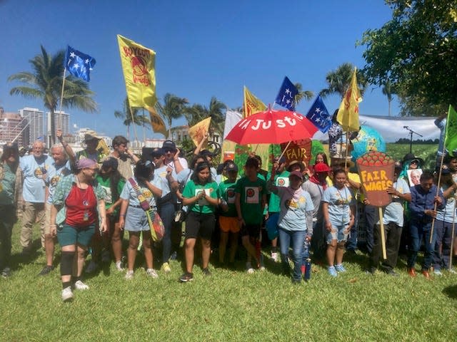 Farmworkers march in Palm Beach on Saturday as part of a protest calling on certain companies to create better working conditions in agriculture.