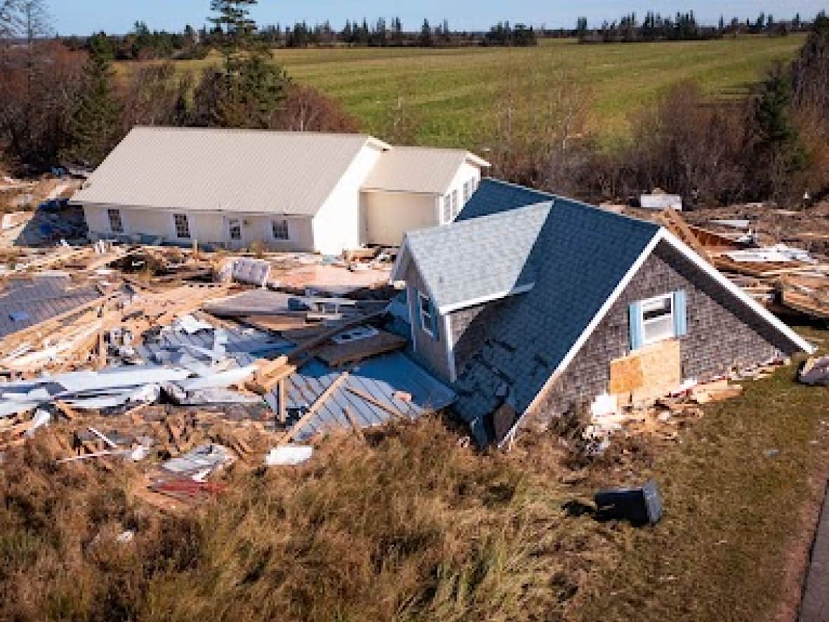 Weeks after post-tropical storm Fiona ripped through the Hebrides cottage community on New London Bay near Stanley Bridge, P.E.I., buildings and debris still littered the countryside and shoreline. (Shane Hennessey/CBC  - image credit)
