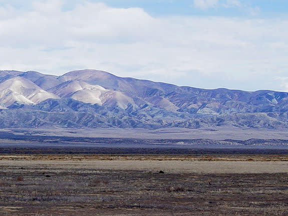 View looking east toward the Temblor Range in California's Coast Ranges. The trace of the San Andreas Fault is midway across the right side of the image about halfway across the valley.