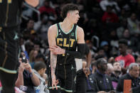 Charlotte Hornets guard LaMelo Ball (1) reacts after scoring against the Washington Wizards during the first half of an NBA basketball game Wednesday, Feb. 8, 2023, in Washington. (AP Photo/Jess Rapfogel)