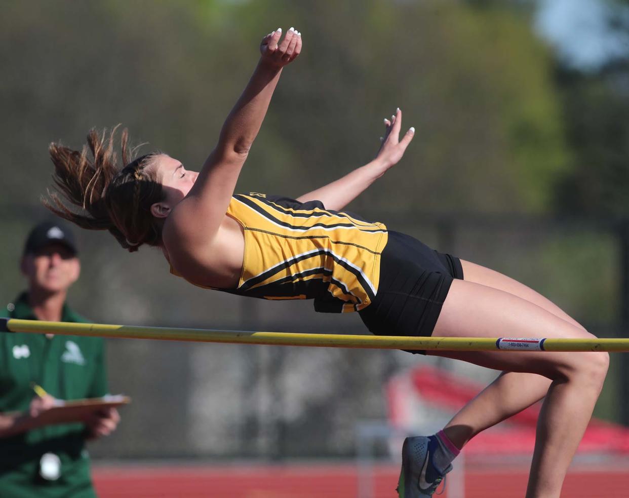 Ellie Brustoski of Cuyahoga Falls jumps to a first place finish at the Suburban League American Conference Track Meet at Tallmadge High School in Tallmadge on Monday.