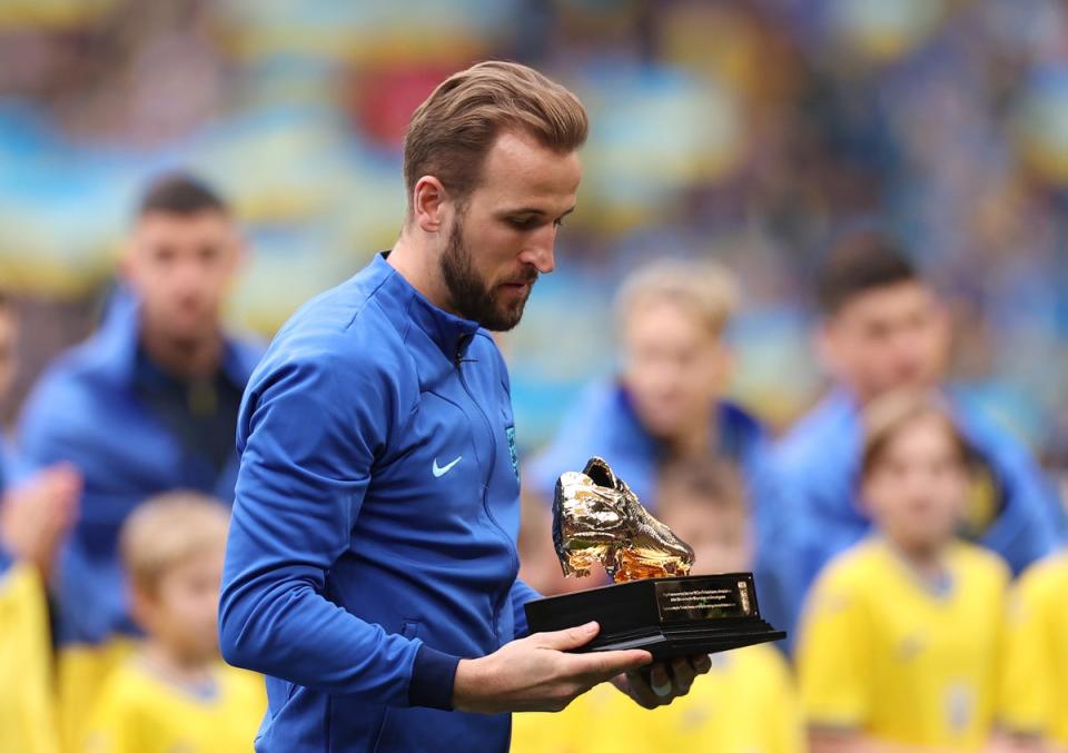 Harry Kane receives a Golden Boot trophy after becoming England’s record scorer (Getty Images)