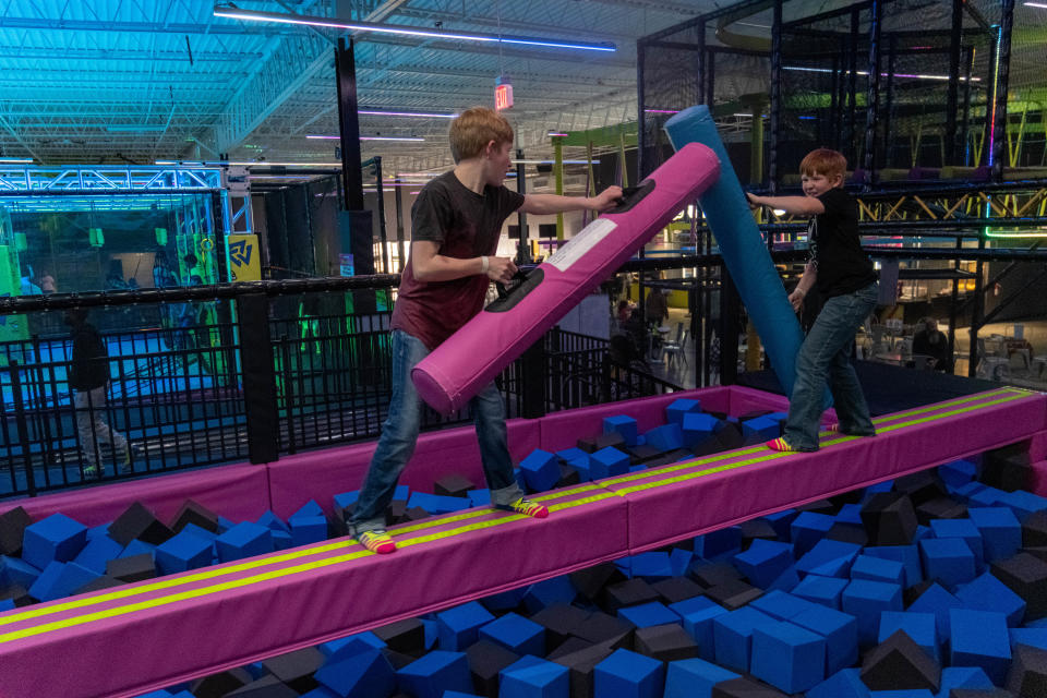 Two boys take on the Battle Beam at Urban Air Adventure Park in Amarillo.