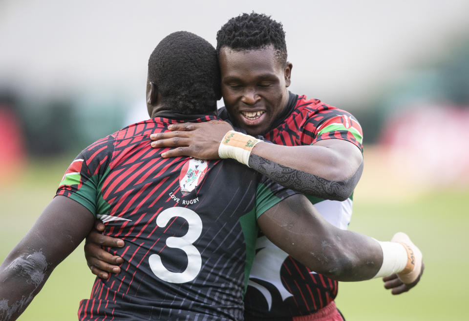 Kenya's Alvin Otieno, left, and teammate Alvin Marube celebrate a try against Germany during a quarterfinal match at the HSBC Canada Sevens rugby tournament in Edmonton, Alberta on Sunday, Sept. 26, 2021. (Jason Franson/The Canadian Press via AP)