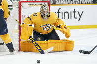 FILE - In this Saturday, May 1, 2021 file photo ,Nashville Predators goaltender Juuse Saros (74) blocks a shot against the Dallas Stars in the third period of an NHL hockey game in Nashville, Tenn. Goalie Juuse Saros is the biggest reason the Nashville Predators went from a potential NHL draft lottery team to their seventh straight playoff appearance. How long they stick around will depend on just how well Saros keeps playing in net.(AP Photo/Mark Humphrey, File)