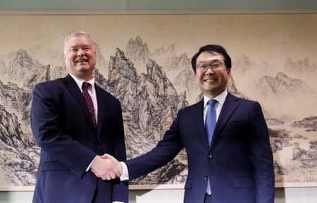 U.S. special envoy for North Korea Stephen Biegun shakes hands with his South Korean counterpart Lee Do-hoon during their meeting at the Foreign Ministry in Seoul