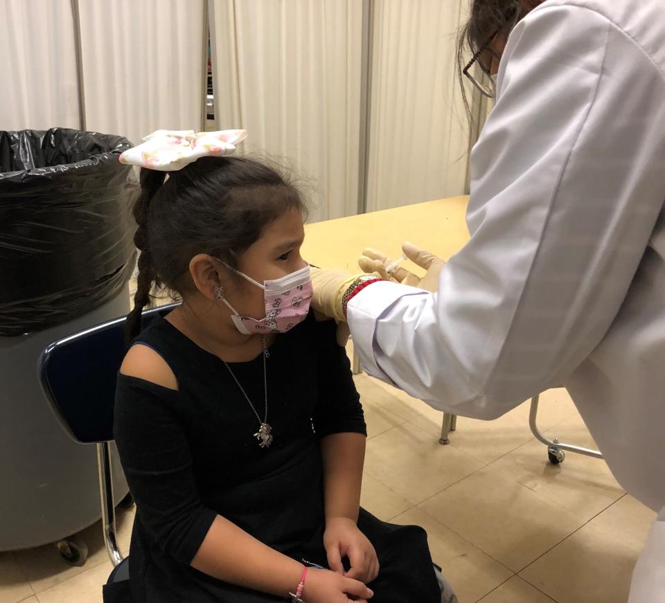 Camila Escovedo, 5, gets her first COVID vaccine dose at Kakiat school in Spring Valley on Tuesday, Dec. 7, 2021. Pharmacist Rupal Dar of TruCare in Pomona administered vaccines for children and adults, as well as boosters, during the clinic at the East Ramapo school.