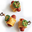 <p>Roll corn tortillas around a sausage and seal with creamy, melty cheese. Top with jalapeños, which add a spicy kick to this childhood classic. Ready in just under 15 minutes, this quick weekday snack is also perfect for parties, picnics, and barbecues.</p> <p> <a rel="nofollow noopener" href="http://www.myrecipes.com/recipe/cheesy-sausage-roll-ups" target="_blank" data-ylk="slk:View Recipe: Cheesy Sausage Roll-Ups;elm:context_link;itc:0;sec:content-canvas" class="link ">View Recipe: Cheesy Sausage Roll-Ups</a></p>