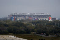Raymond James Stadium rises in the distance ahead of Super Bowl 55 Saturday, Feb. 6, 2021, in Tampa, Fla. The venue is hosting Sunday's Super Bowl football game between the Tampa Bay Buccaneers and the Kansas City Chiefs. (AP Photo/Charlie Riedel)