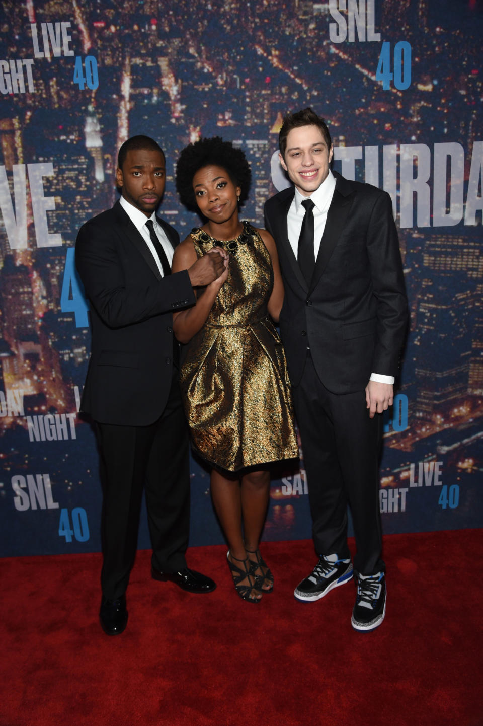 Current castmembers Jay Pharoah, Sasheer Zamata, and Pete Davidson make the step-and-repeat silly. While the boys look sharp in the suits, Zamata’s gold dress is fitting for the celebratory atmosphere.