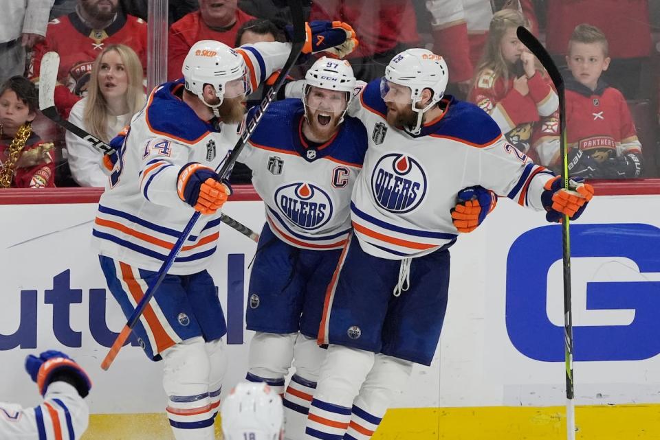 Edmonton Oilers center Connor McDavid (97) celebrates his goal during the third period of Game 5 of the NHL hockey Stanley Cup Finals against the Florida Panthers, Tuesday, June 18, 2024, in Sunrise, Fla. The Oilers defeated the Panthers 5-3. (AP Photo/Rebecca Blackwell)