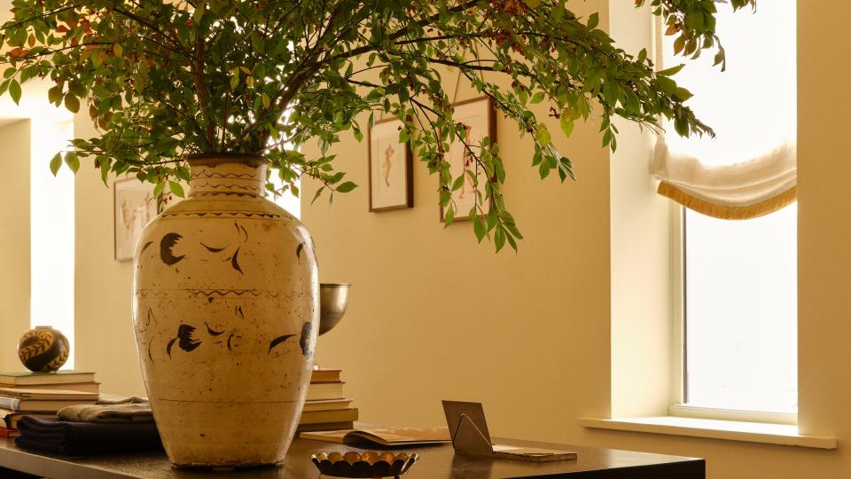 table with books and vase