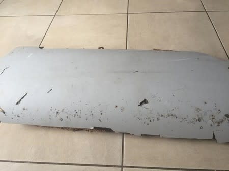 A piece of debris found by a South African family off the Mozambique coast in December 2015, which authorities will examine to see if it is from missing Malaysia Airlines flight MH370, is pictured in this handout photo released to Reuters March 11, 2016. REUTERS/Candace Lotter/Handout via Reuters