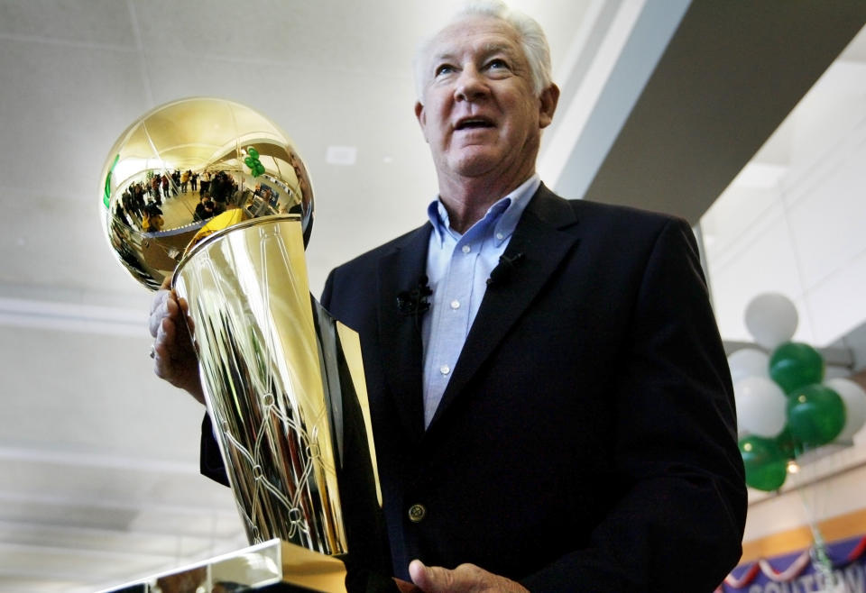 FILE - In this Wednesday, June 4, 2008 file photo, NBA legend John Havlicek holds the Larry O'Brien NBA Championship Trophy at Manchester Boston Regional Airport in Manchester, N.H. The Boston Celtics say Hall of Famer John Havlicek, whose steal of Hal Green’s inbounds pass in the final seconds of the 1965 Eastern Conference finals against the Philadelphia 76ers remains one of the most famous plays in NBA history, has died. The team says Havlicek died Thursday, April 25, 2019 at age 79. (AP Photo/Cheryl Senter, File)