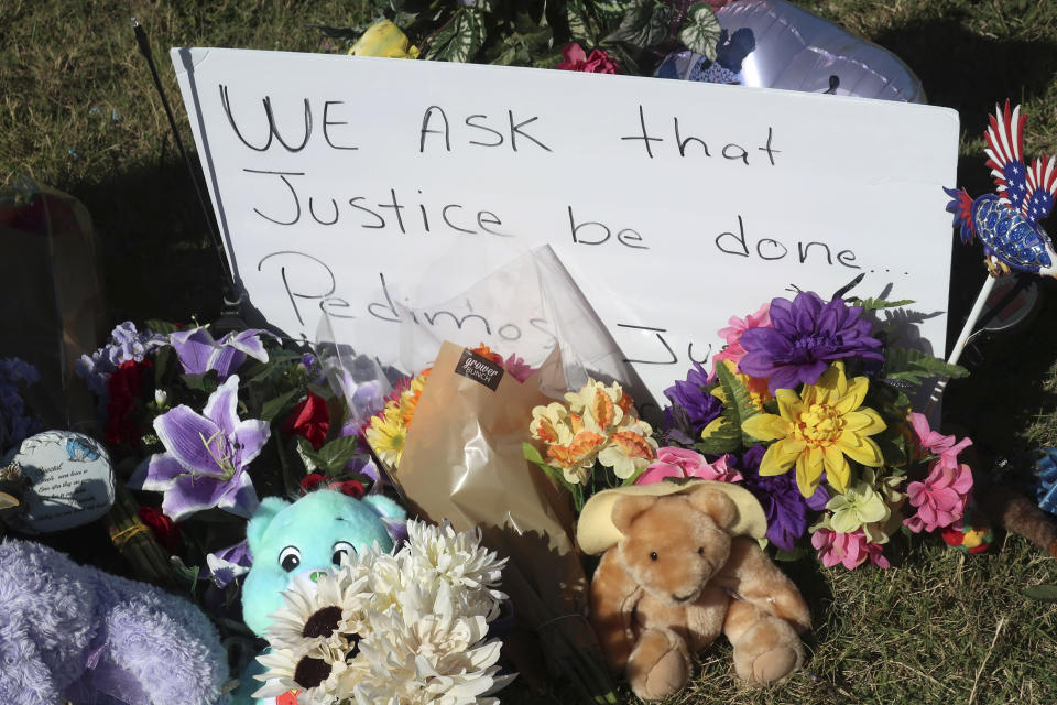 A sign calling for justice sits among toys, balloons and flowers in a makeshift memorial honoring Zoey Felix, a 5-year-old girl, Thursday, Oct. 5, 2023, in Topeka, Kansas. A homeless man has been charged with murder and rape and could face the death penalty in connection with Felix's death. (AP Photo/John Hanna)
