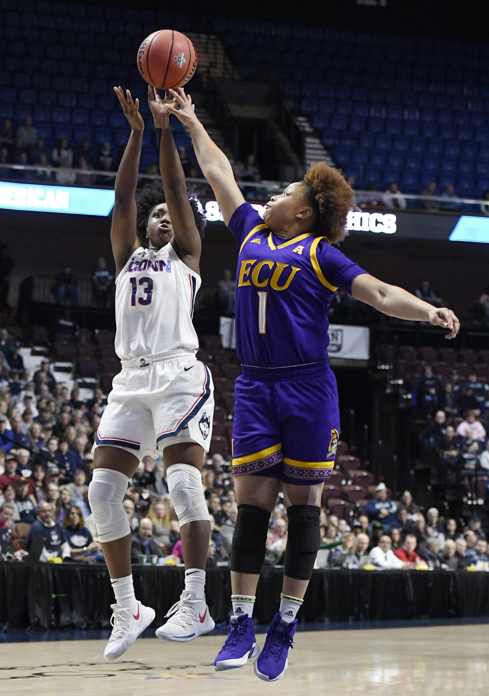 Connecticut's Christyn Williams shoots over East Carolina's Alex Frazier during the first half of an NCAA college basketball game in the American Athletic Conference tournament quarterfinals, Saturday, March 9, 2019, at Mohegan Sun Arena in Uncasville, Conn. (AP Photo/Jessica Hill)