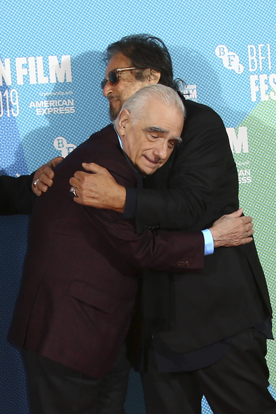 Actor Al Pacino, right, embraces director Martin Scorsese at the photocall of the film 'The Irishman' as part of the London Film Festival, in central London, Sunday, Oct. 13, 2019. (Photo by Joel C Ryan/Invision/AP)