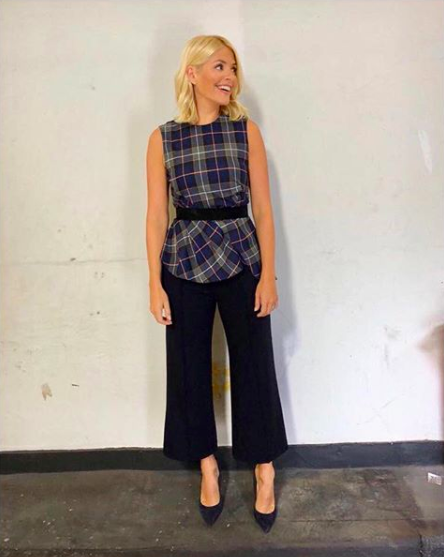 <p>Holly Willoughby sent fans straight to Zara on September 5 after sharing a snap of her checked pleated <a rel="nofollow noopener" href="https://www.zara.com/uk/en/pleated-checked-top-p08062637.html?v1=7094635&v2=1074565" target="_blank" data-ylk="slk:blouse" class="link ">blouse</a>. She teamed the look with a pair of Jigsaw trousers and LK Bennett shoes. Anyone else craving a shopping spree? <em>[Photo: Instagram]</em> </p>