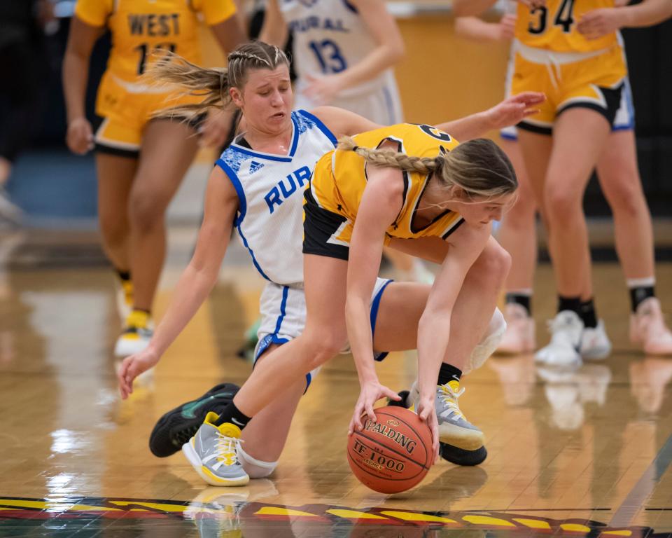 Washburn Rural Emma Krueger (11) runs for a loose ball against Shawnee Mission West Izzy Joyce (3) Saturday Jan. 29, 2022, at Lawrence Free State High School in Lawrence, Kan.