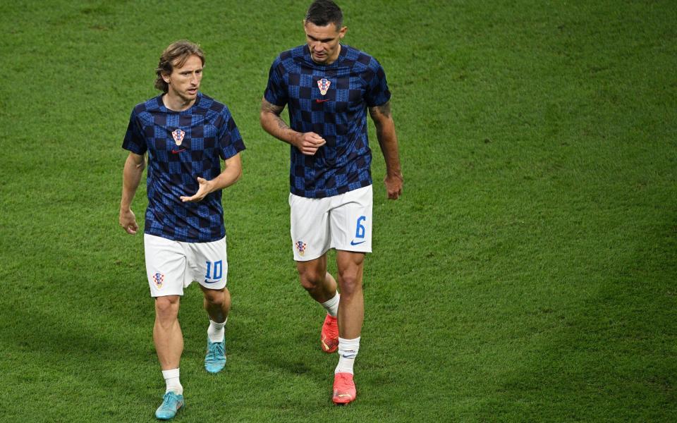 Luka Modric (L) and Dejan Lovren of Croatia warm up prior to the FIFA World Cup Qatar 2022 Group F match between Croatia and Canada at Khalifa International Stadium - Stuart Franklin/Getty Images