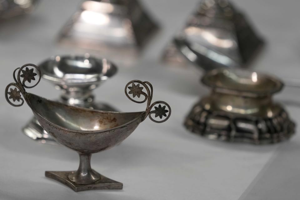 Some of the 111 silver objects stolen by the Nazis from the Jews during the Third Reich, stand at the Bavarian National Museum in Munich, Germany, Saturday, June 10, 2023. Museum staff have made it their mission to return as many of the silver objects as possible to the descendants of the original owners. (AP Photo/Matthias Schrader)