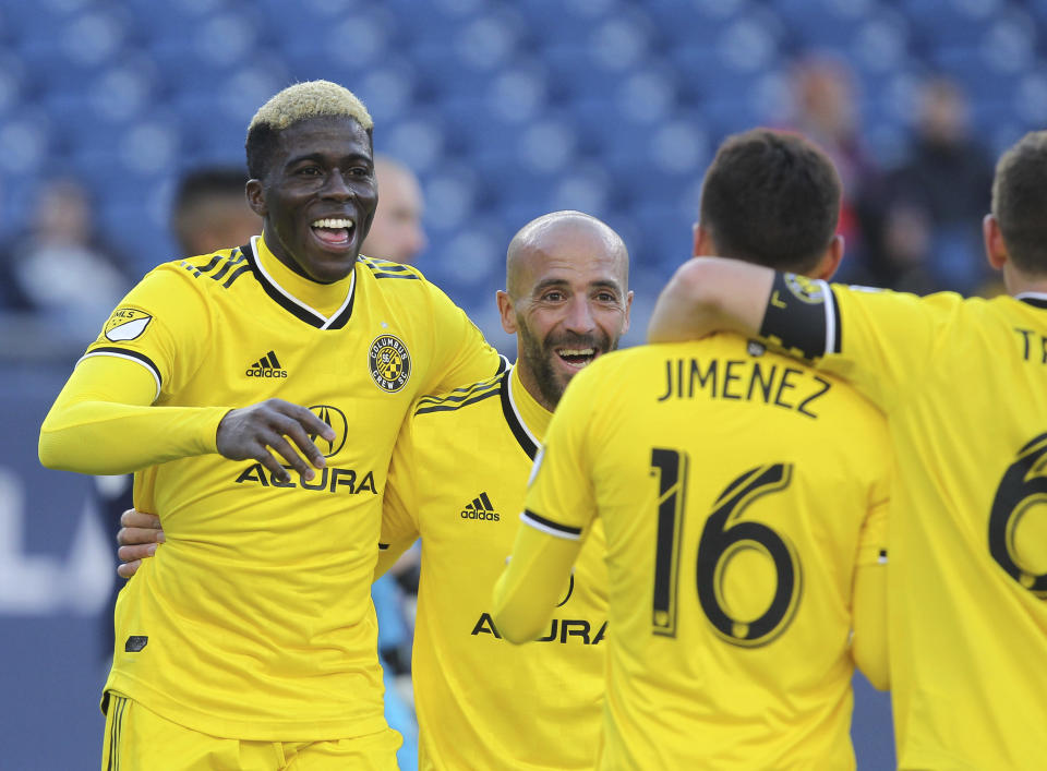 Columbus Crew's Gyasi Zardes, left, celebrates his second goal of the game with his team during the second half of an MLS soccer game against the New England Revolution, Saturday, March 9, 2019, in Foxborough, Mass. (AP Photo/Stew Milne)