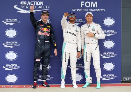 Britain Formula One - F1 - British Grand Prix 2016 - Silverstone, England - 9/7/16 Mercedes' Lewis Hamilton celebrates qualifying in pole position with Mercedes' Nico Rosberg who finished in second place and Red Bull's Max Verstappen who finished in third Reuters / Matthew Childs Livepic