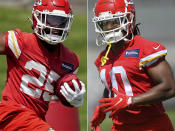 FILE - At left, Kansas City Chiefs running back Clyde Edwards-Helaire runs a drill during the NFL football team's organized team activities Thursday, June 2, 2022, in Kansas City, Mo. At right, Chiefs running back Isiah Pacheco is shown during drills at the NFL football team's mandatory minicamp Tuesday, June 14, 2022, in Kansas City, Mo. A third of the way through training camp, the two are in a heated race to be the starting running back of the Chiefs. (AP Photo/File)