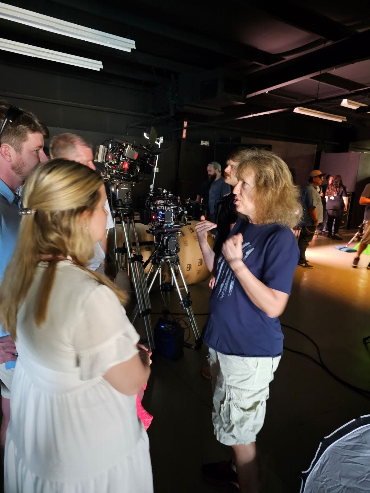 Producer Gina Goff, right, on the set of her movie, "The Movers" in Mississippi. The horror film is about a family who tries to find a way out of a new, mysterious neighborhood.