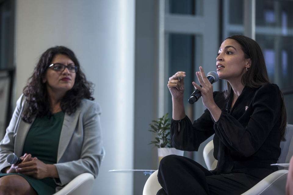 Reps. Rashida Tlaib and Alexandria Ocasio-Cortez at a town hall hosted by the NAACP in 2019. (Zach Gibson/Getty Images)