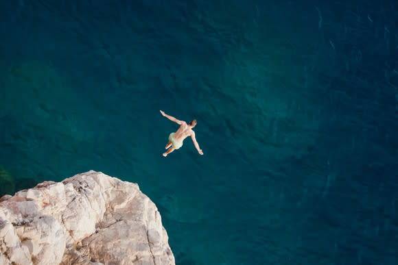 A person jumping into the water