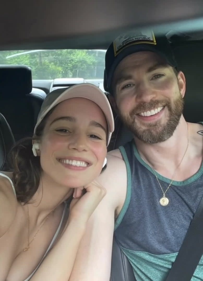 Alba and Chris smile for a picture as they sit in a car