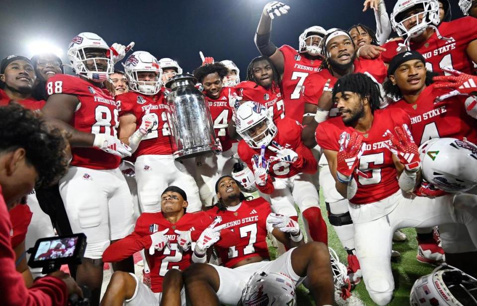 Fresno State celebrates winning the Battle of the Milk Can with a 37-30 victory over Boise State Saturday, Nov. 4, 2023 in Fresno.