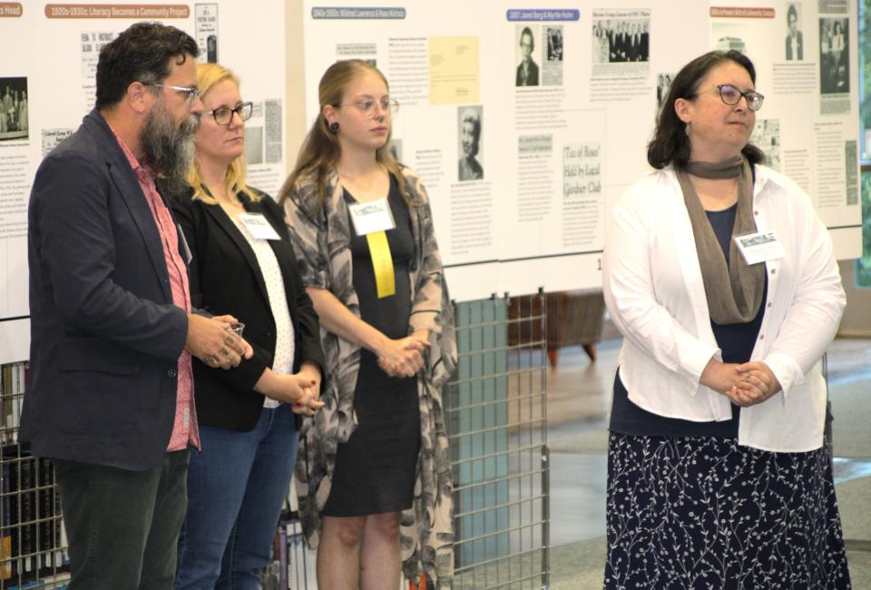 The Ohio State University at Marion professors Ben McCorkle (English), Nikole Patson (psychology), and Margaret Sumner (history) are shown with student researcher Cheyenne Anderson, third from left, during an open house celebrating their literacy history project.