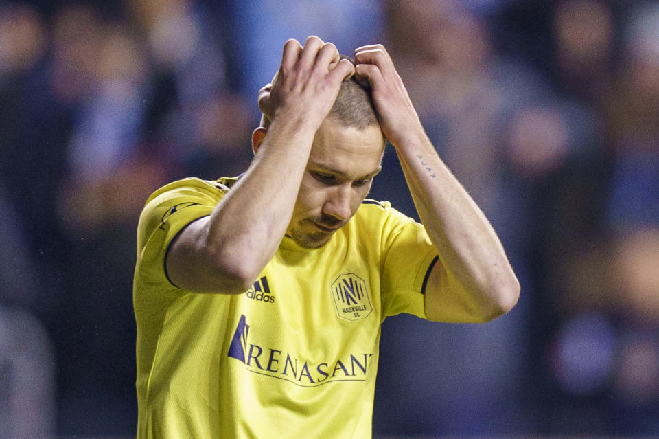 Nashville SC's Alex Muyl reacts to missing his shootout goal attempt during the shootout of an MLS playoff soccer match against the Philadelphia Union, Sunday, Nov. 28, 2021, in Chester, Pa. The Union won 2-0 in the penalty kick shootout after tying 1-1 in regulation time. (AP Photo/Chris Szagola)