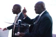 Ghana Aviation Minister Joseph Kofi Adda gestures while holding a model Boeing aircraft at a news conference at the Dubai Airshow in Dubai, United Arab Emirates, Tuesday, Nov. 19, 2019. Ghana said Tuesday that it will launch a national airline early next year with three new Boeing long-haul, widebody 787-9 Dreamliners. (AP Photo/Jon Gambrell)