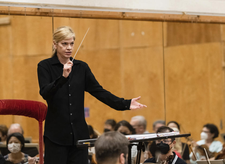 This image released by the Metropolitan Opera shows Keri-Lynn Wilson conducting a rehearsal for Shostakovich's "Lady Macbeth of Mtsensk" at the Metropolitan Opera in New York on Sept. 8, 2022. (Jonathan Tichler/Metropolitan Opera via AP)